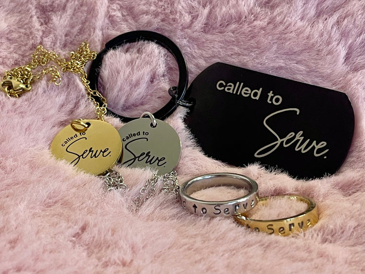 gold called to serve necklace with floral painted book of mormon in the background