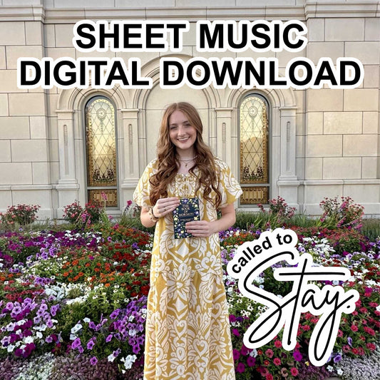 Woman holding book of mormon and advertising sheet music digital download with floral garden and building in background